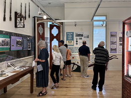 "People looking at historical exhibits"