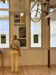 "Person looking at artifacts in the gallery"